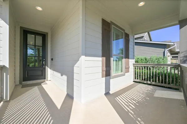 a view of a balcony with wooden floor