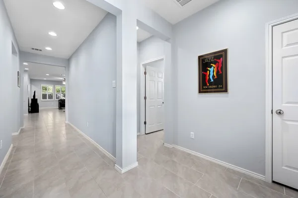 wooden floor in a hall with an entryway