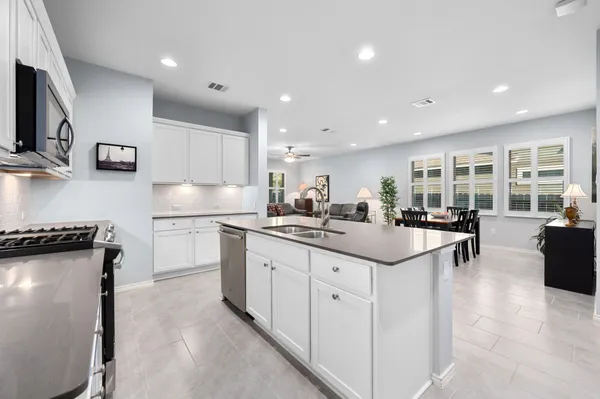 a kitchen with counter top space and appliances