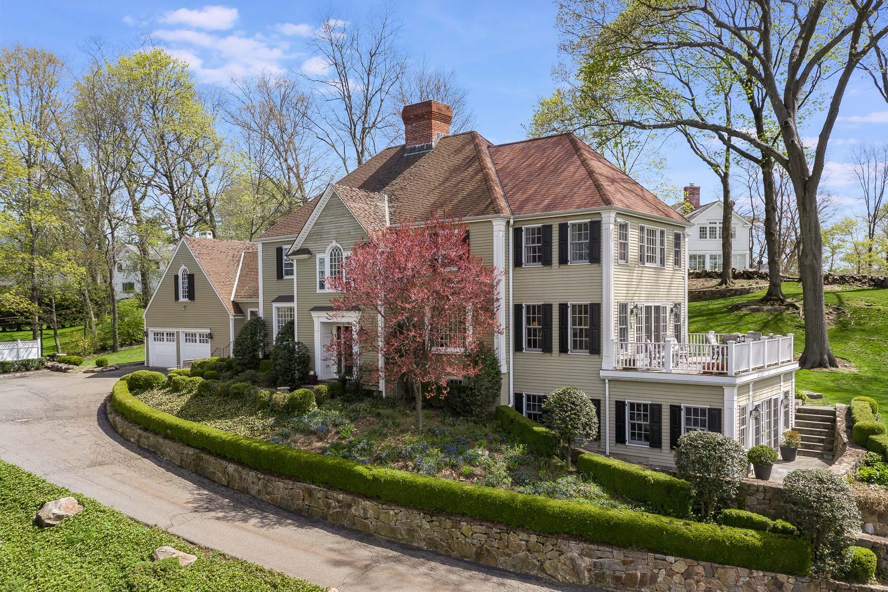 110 Goodwives River Road Darien, CT 06820 - Photo 1 of 23 a front view of a house with a garden