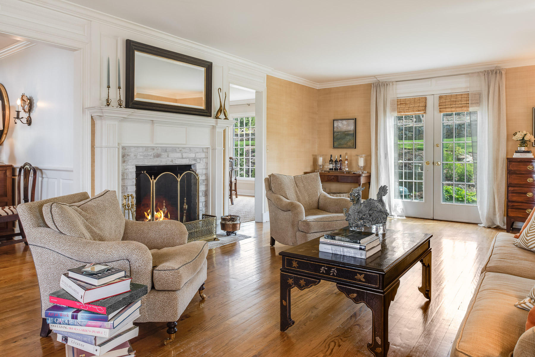 110 Goodwives River Road Darien, CT 06820 - Photo 14 of 23 a living room with furniture a flat screen tv and a fireplace