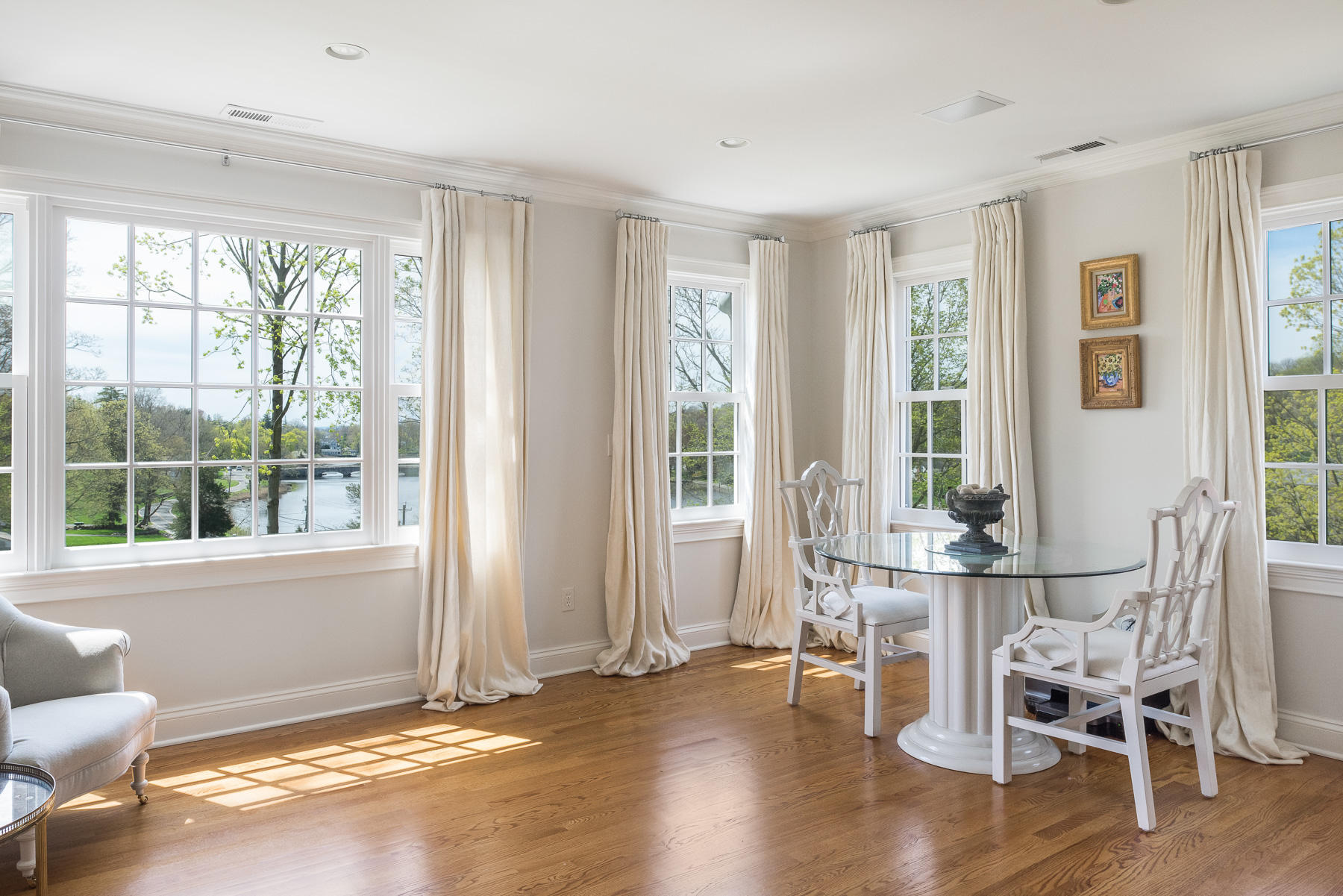 110 Goodwives River Road Darien, CT 06820 - Photo 19 of 23 a dining room with wooden floor and windows