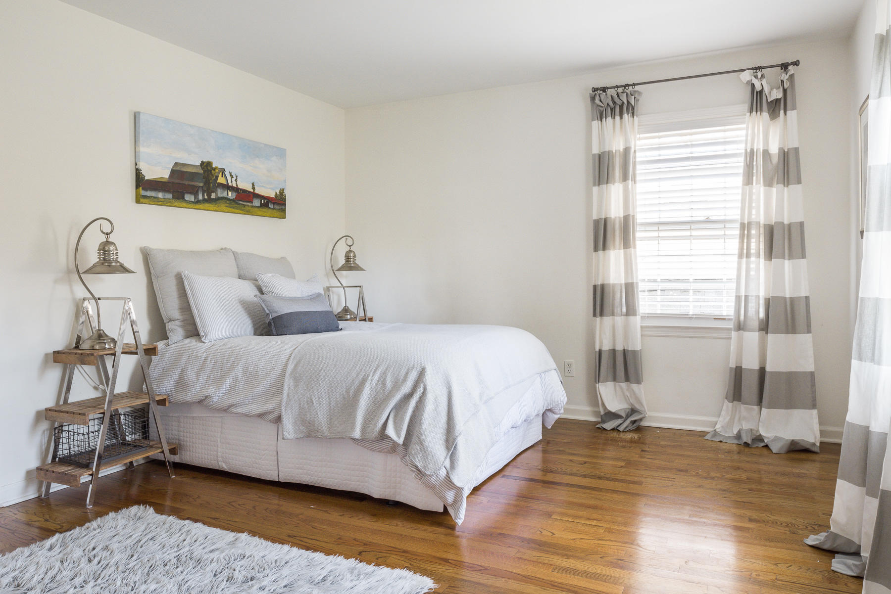 110 Goodwives River Road Darien, CT 06820 - Photo 21 of 23 a large bed sitting in a bedroom next to a window