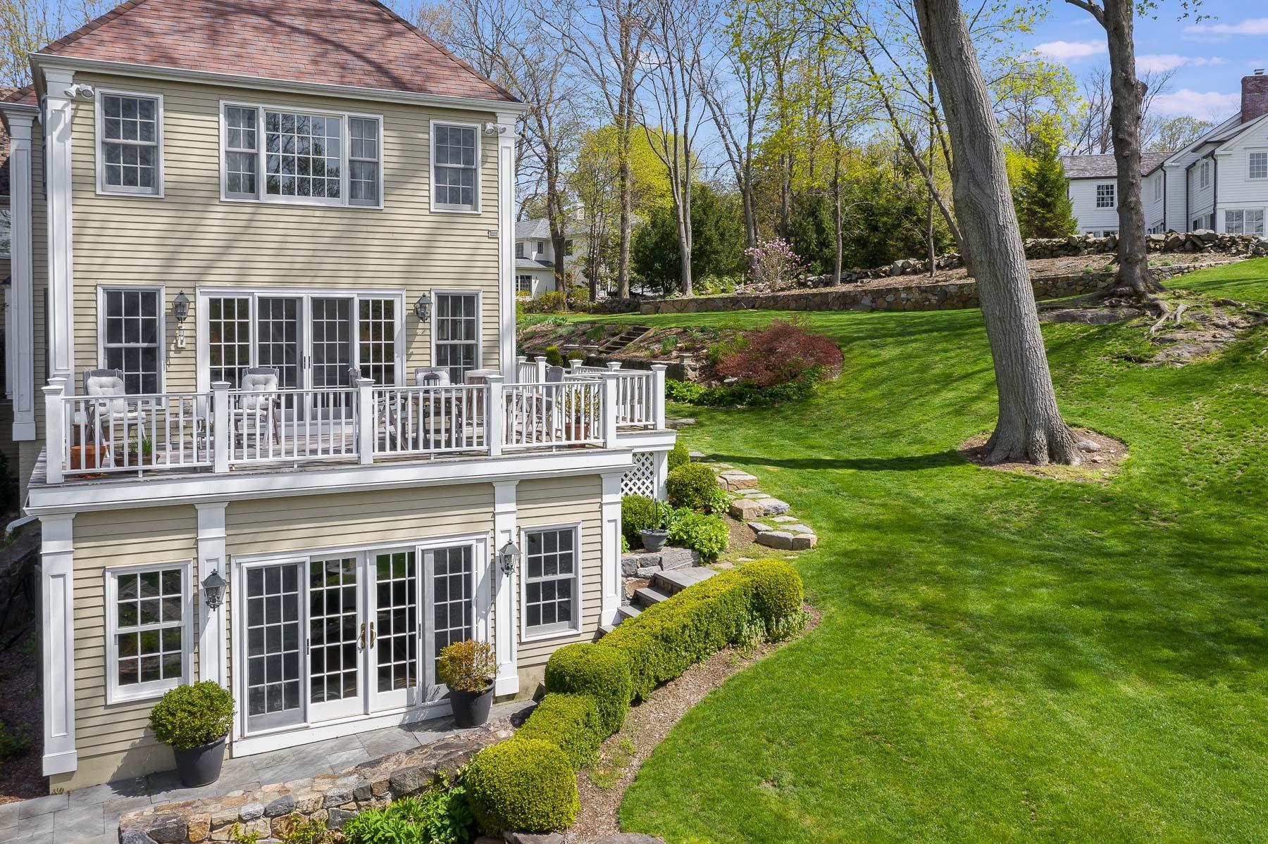 110 Goodwives River Road Darien, CT 06820 - Photo 3 of 23 front view of a house with a yard
