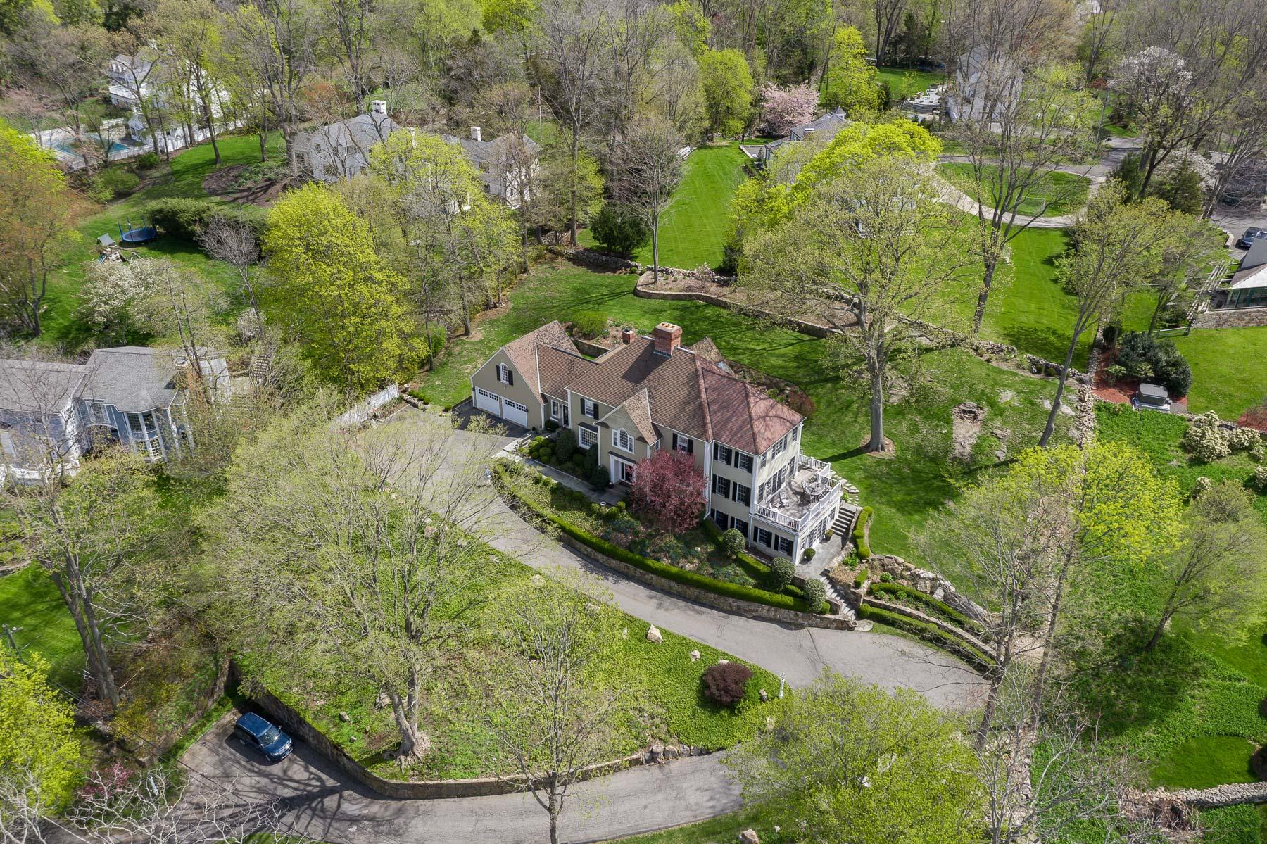 110 Goodwives River Road Darien, CT 06820 - Photo 7 of 23 an aerial view of a house with a yard large trees