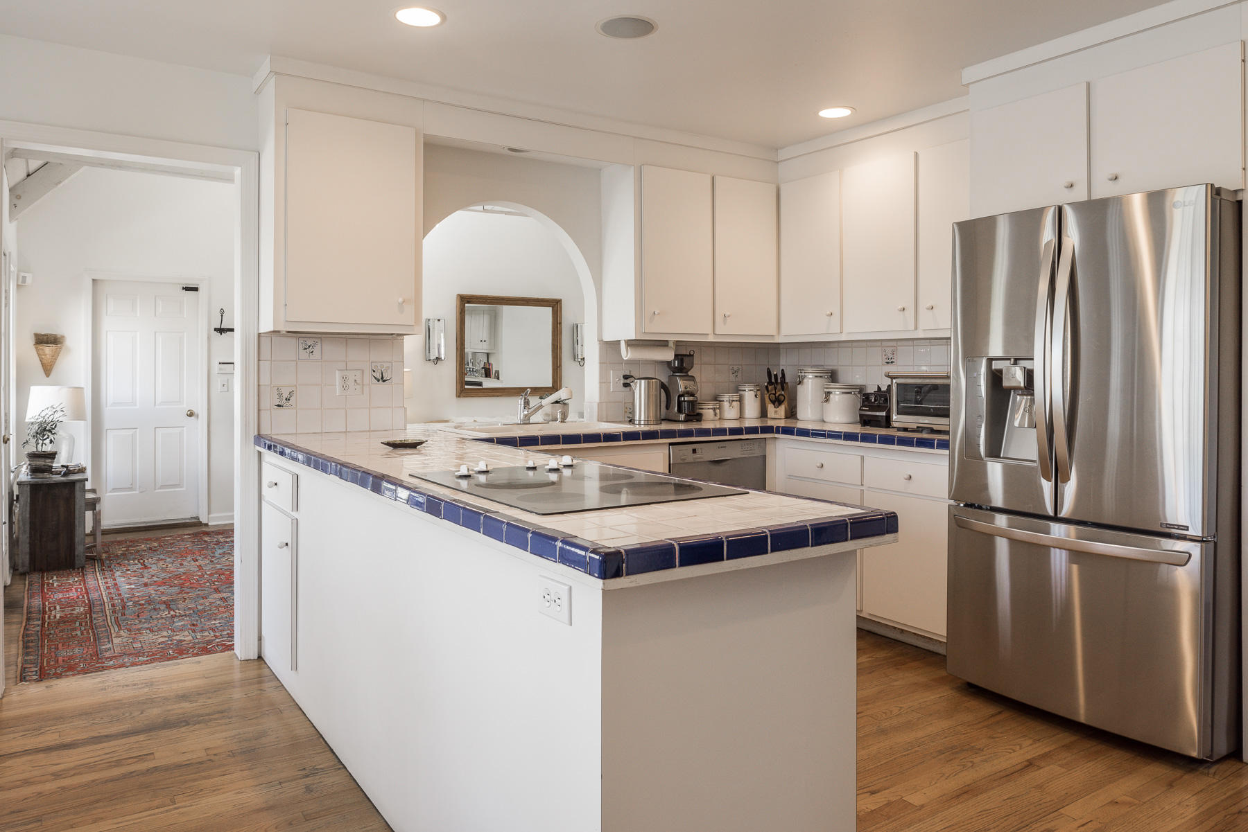 110 Goodwives River Road Darien, CT 06820 - Photo 10 of 23 a kitchen with stainless steel appliances granite countertop a sink stove and refrigerator