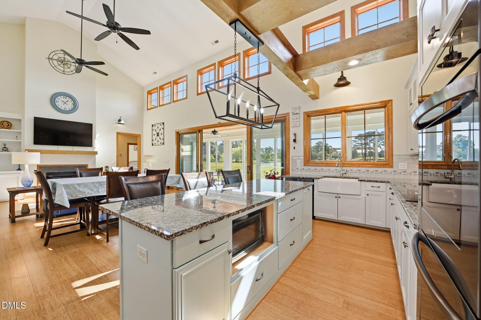 35 North Rippling Court Smithfield, NC 27577 - Photo 12 of 59 a large white kitchen with a stove and a large window