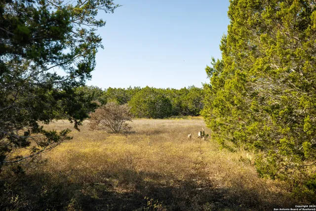 a view of a terrace with furniture and a fireplace