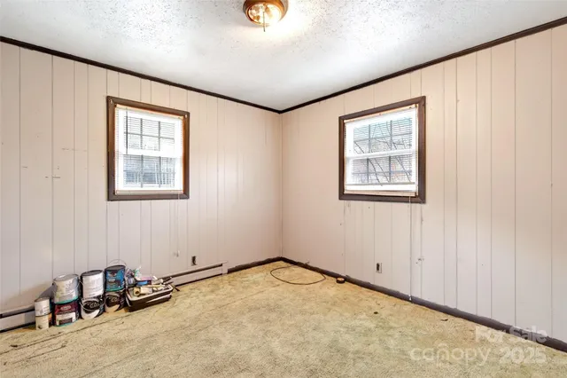 a view of a room with gym equipment and a window