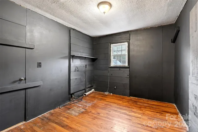 a bedroom with a bed and a closet