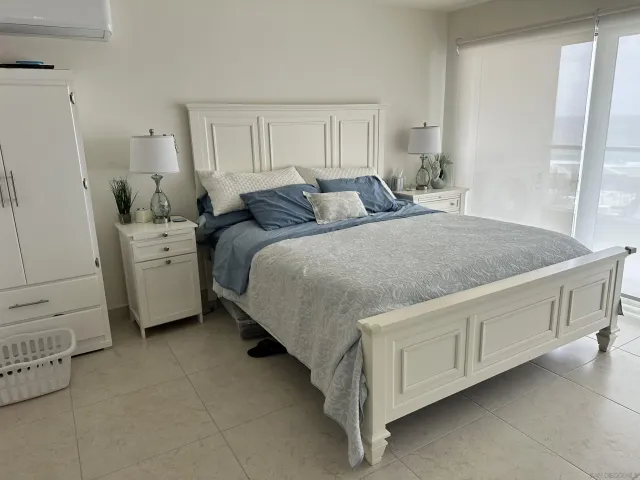 a bed room with a bed and a dresser