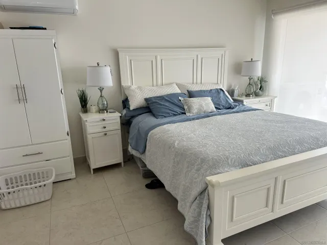 a bed room with a bed and a dresser