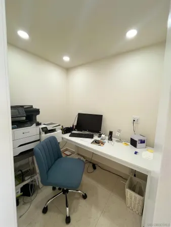 a view of a workspace with furniture
