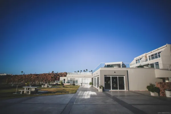 a kitchen with stainless steel appliances granite countertop a refrigerator sink and white cabinets