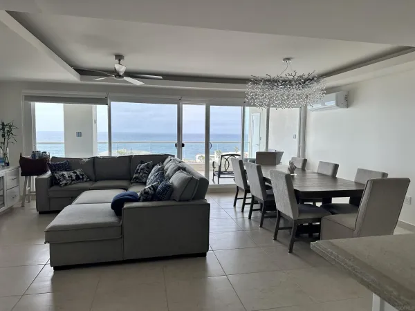 a living room with furniture and a large window