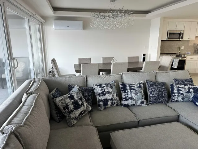 a living room with furniture or couch and a flat screen tv