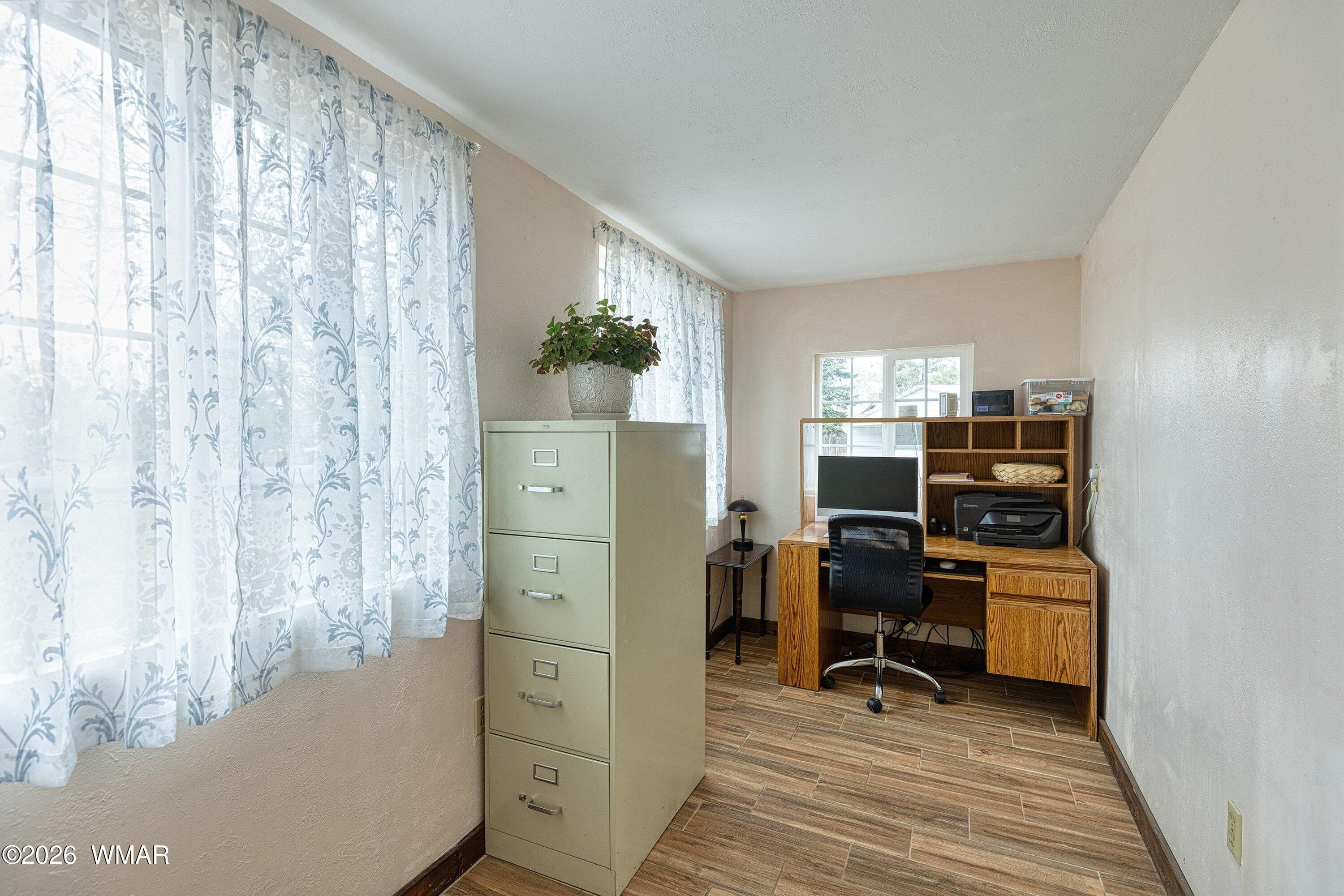 1306 West Pima Lane Lakeside, AZ 85929 - Photo 18 of 31 a view of a workspace with furniture and wooden floor