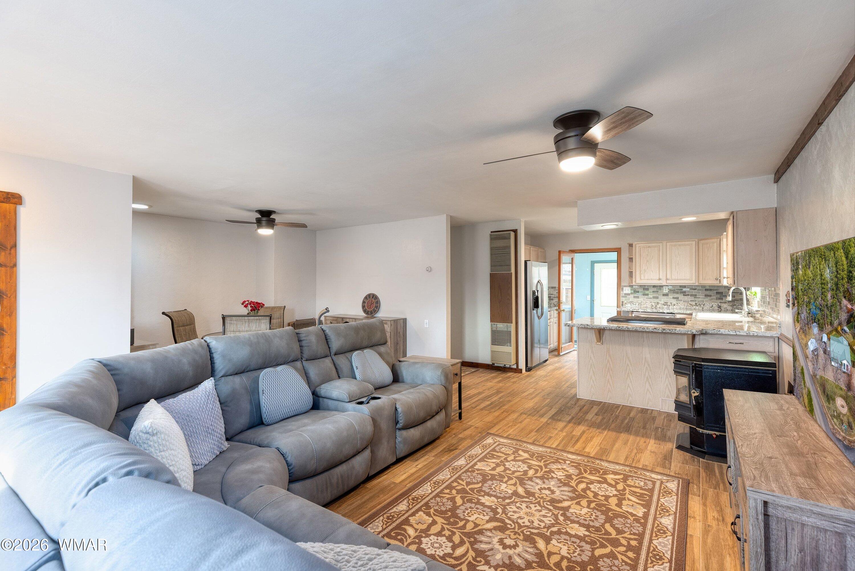 1306 West Pima Lane Lakeside, AZ 85929 - Photo 7 of 31 a living room with furniture and a wooden floor