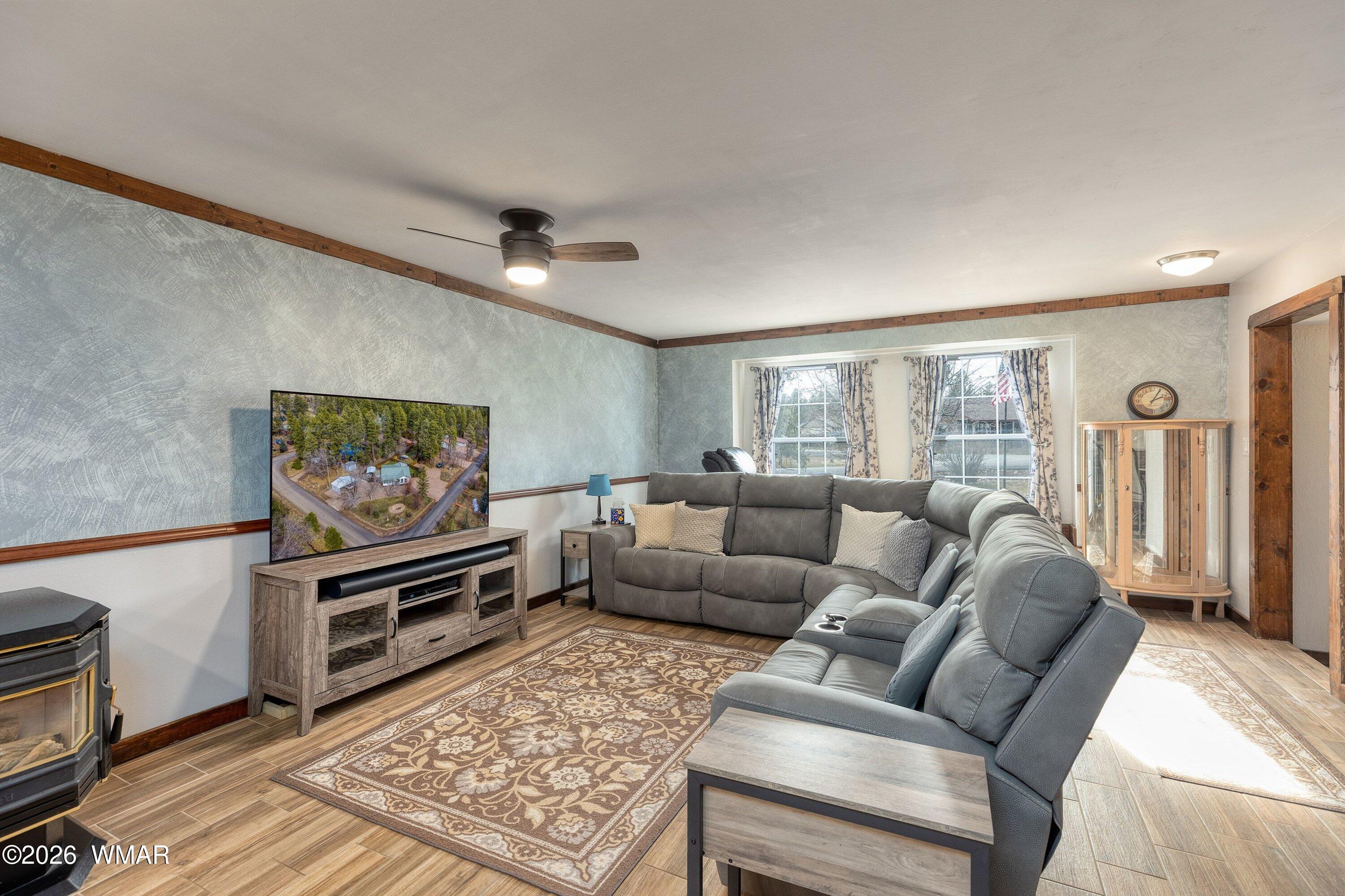 1306 West Pima Lane Lakeside, AZ 85929 - Photo 8 of 31 a living room with furniture and a flat screen tv