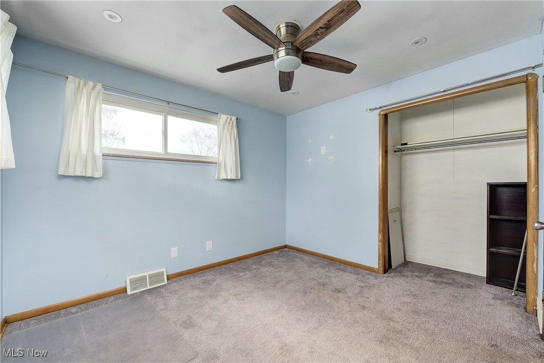11518 Prospect Road Strongsville, OH 44149 - Photo 23 of 46 Unfurnished bedroom with baseboards, visible vents, a closet, and carpet flooring