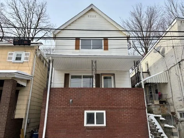 a front view of a house with yard