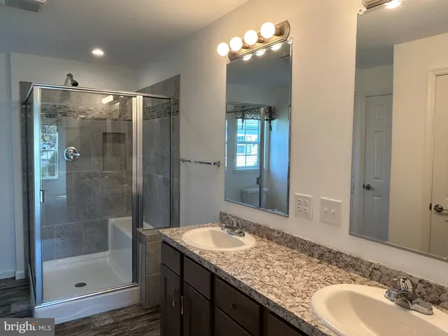 a bathroom with a shower and toilet