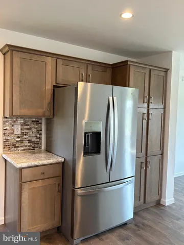 a kitchen with a sink and refrigerator