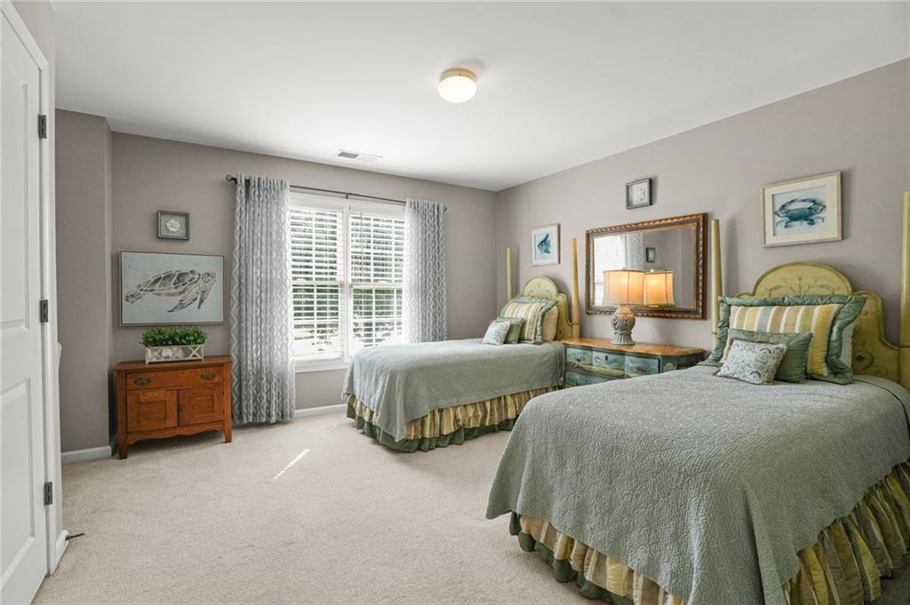 509 Crested Hawk Ridge Canton, GA 30114 - Photo 38 of 89 a bedroom with two beds and painting on the wall