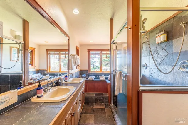 a bedroom with a large bed and a large window