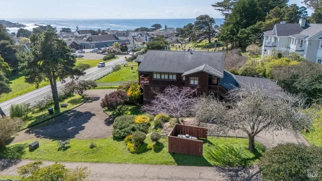 an aerial view of a house with a garden