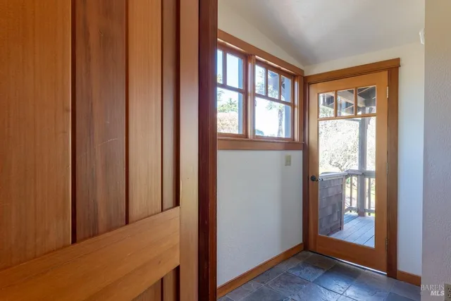 a kitchen with a sink a stove and cabinets