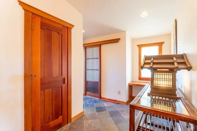 a view of a kitchen with furniture and a window