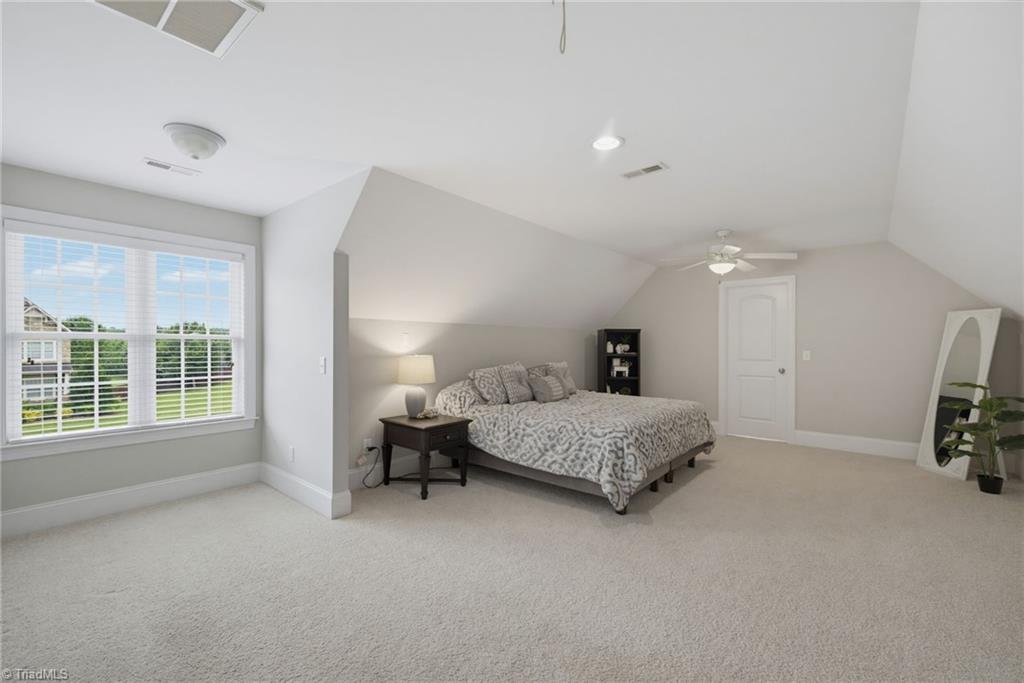 8205 Brotherstwo Road Colfax, NC 27235 - Photo 24 of 47 Bonus room or 4th bedroom with large walk-in closet with a window.