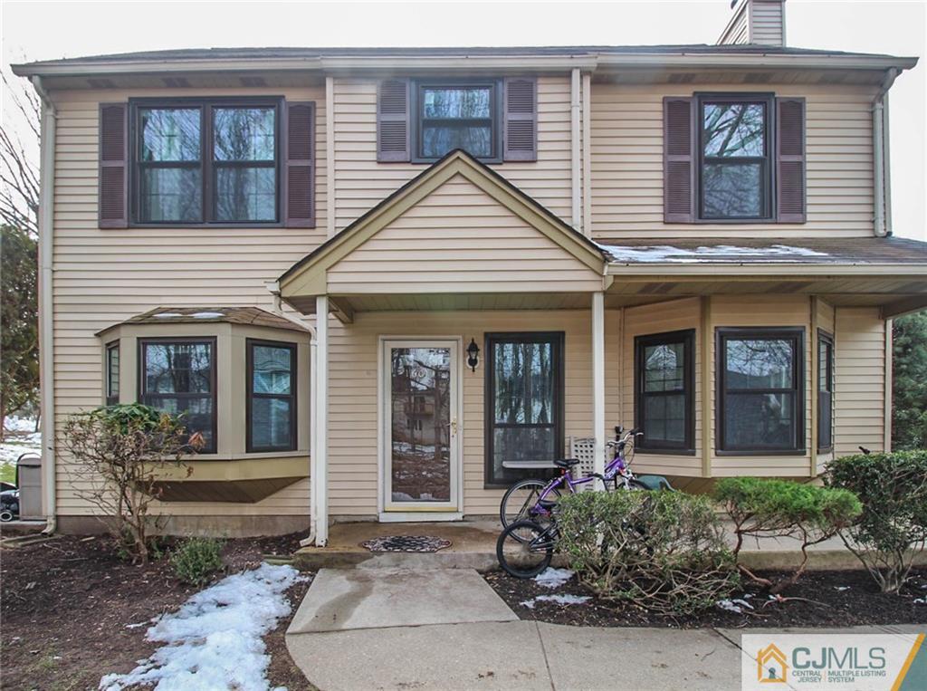 601 Maplecrest Road, Unit 601 Edison, NJ 08820 - Photo 1 of 25 a view of a brick house with large windows and plants