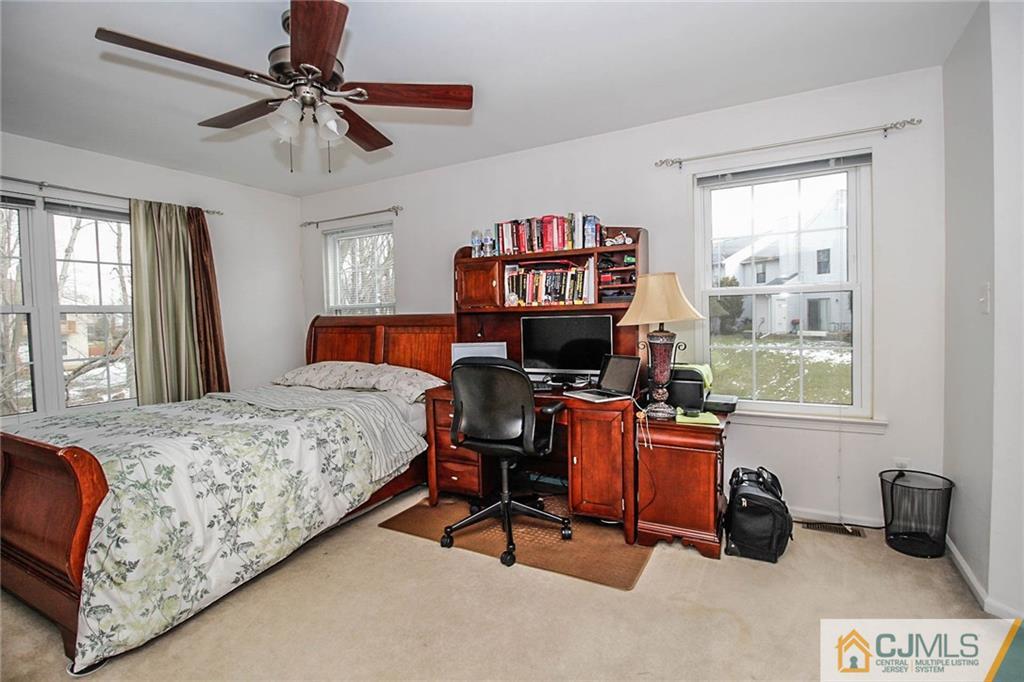 601 Maplecrest Road, Unit 601 Edison, NJ 08820 - Photo 19 of 25 a bedroom with furniture and a flat screen tv