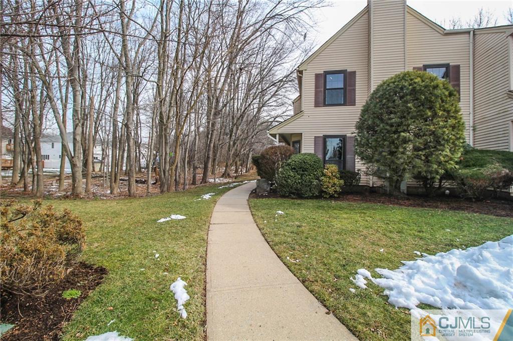 601 Maplecrest Road, Unit 601 Edison, NJ 08820 - Photo 3 of 25 a view of a yard in front of a house