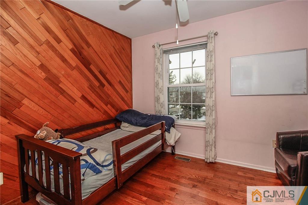 601 Maplecrest Road, Unit 601 Edison, NJ 08820 - Photo 25 of 25 a bedroom with furniture and a window