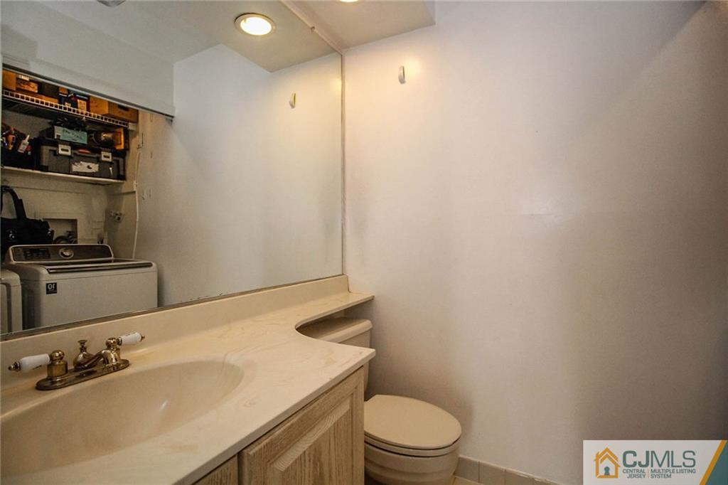 601 Maplecrest Road, Unit 601 Edison, NJ 08820 - Photo 8 of 25 a bathroom with a sink a toilet and vanity