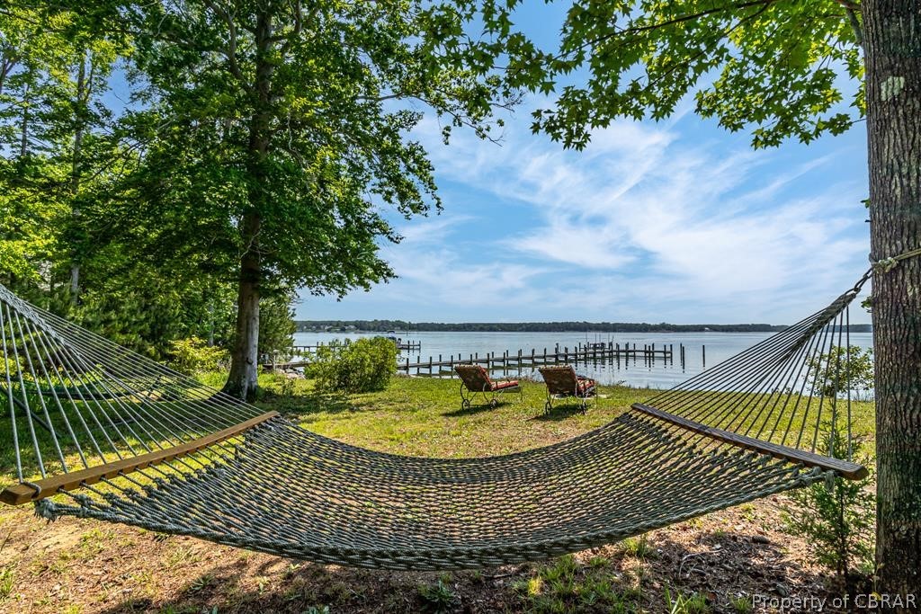 90 Bar Point Road Lancaster, VA 22503 - Photo 33 of 33 a view of swimming pool with a garden and seating area