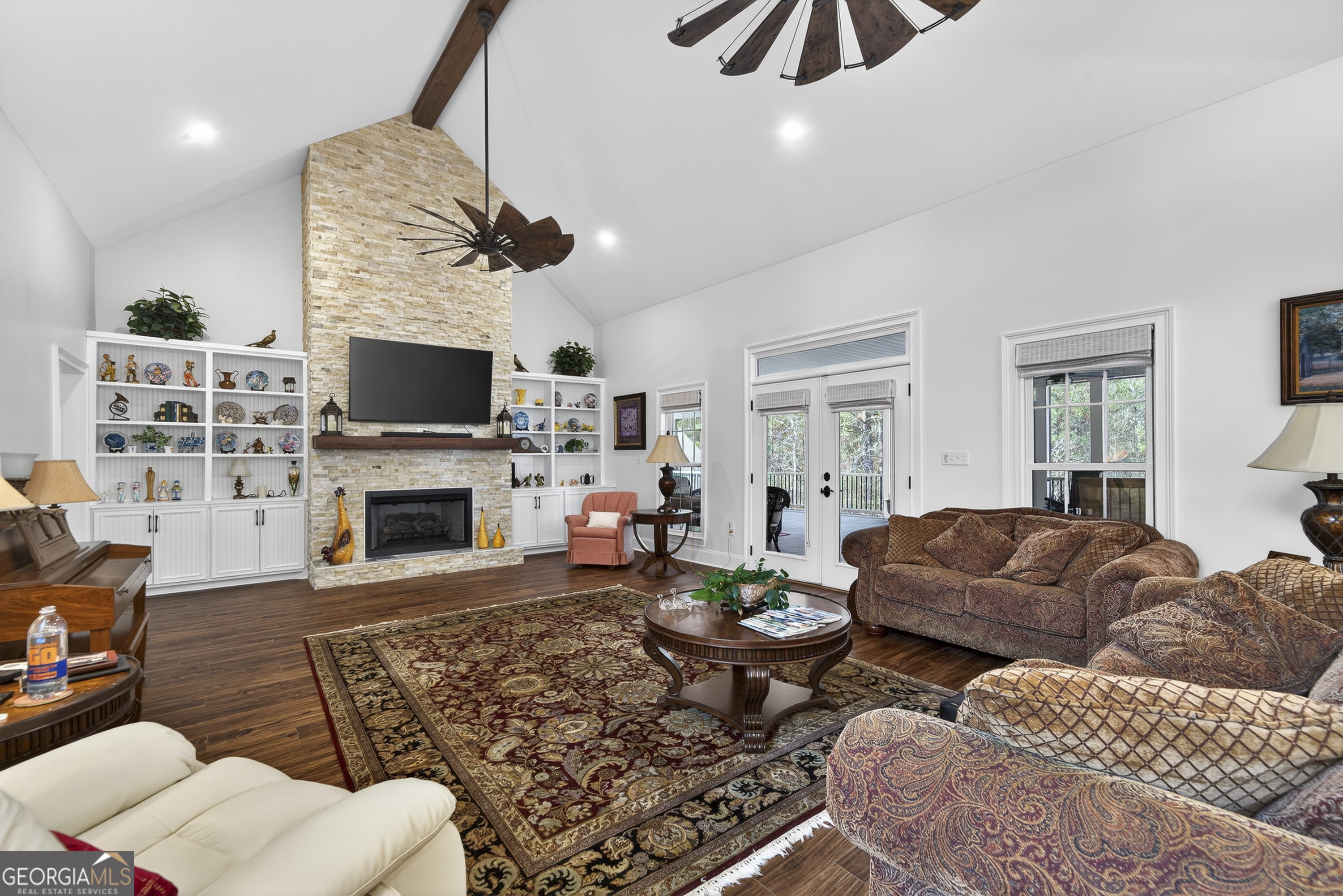 137 Butler Road Southeast Milledgeville, GA 31061 - Photo 12 of 82 a living room with furniture a flat screen tv and a fireplace
