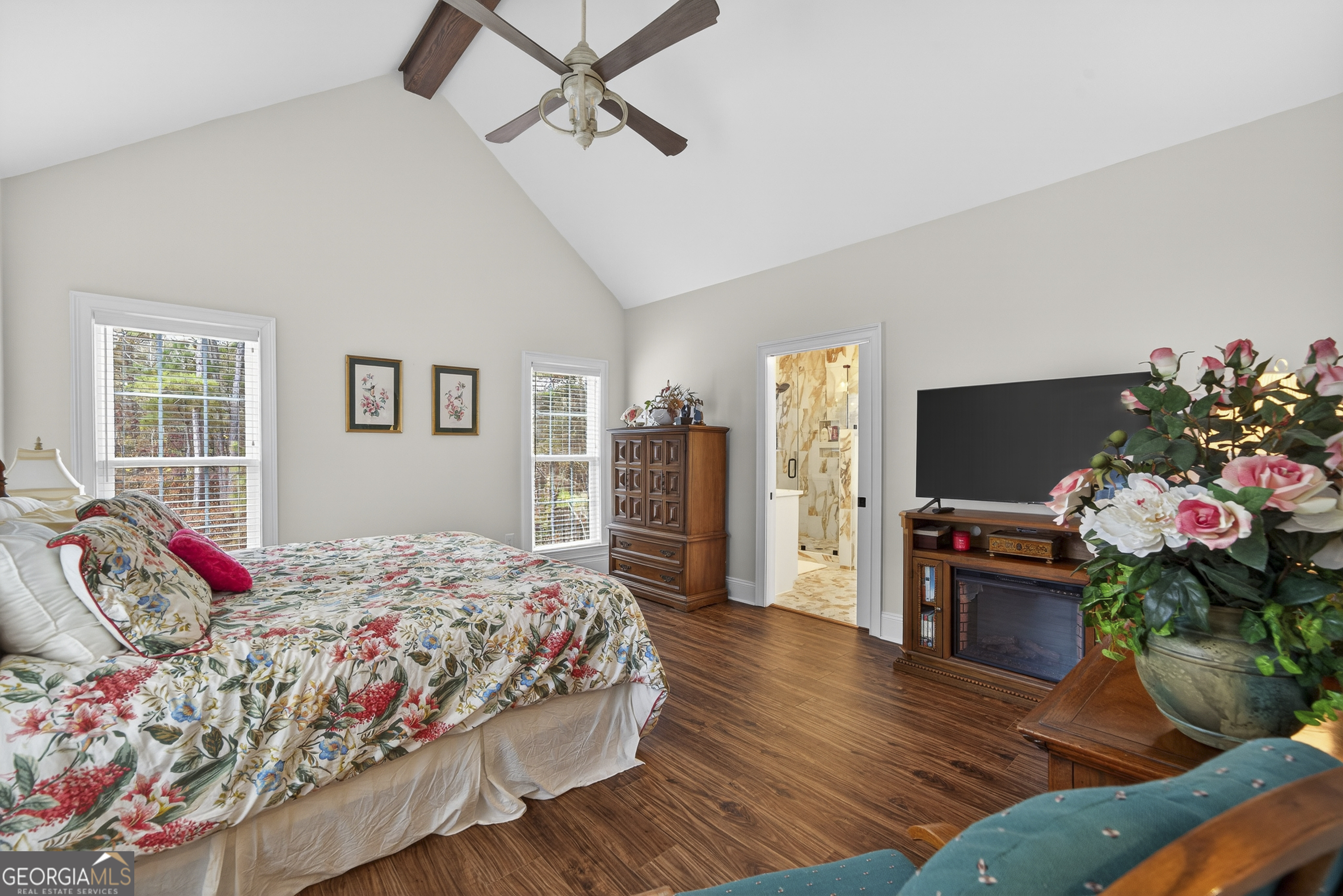 137 Butler Road Southeast Milledgeville, GA 31061 - Photo 28 of 82 a bedroom with a bed and a flat screen tv