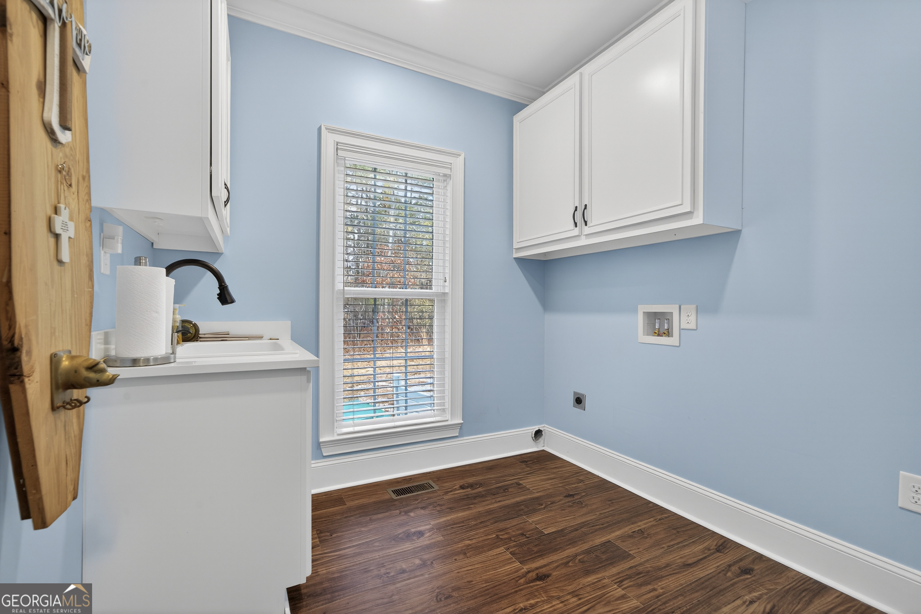 137 Butler Road Southeast Milledgeville, GA 31061 - Photo 37 of 82 a view of a kitchen with wooden floor and electronic window