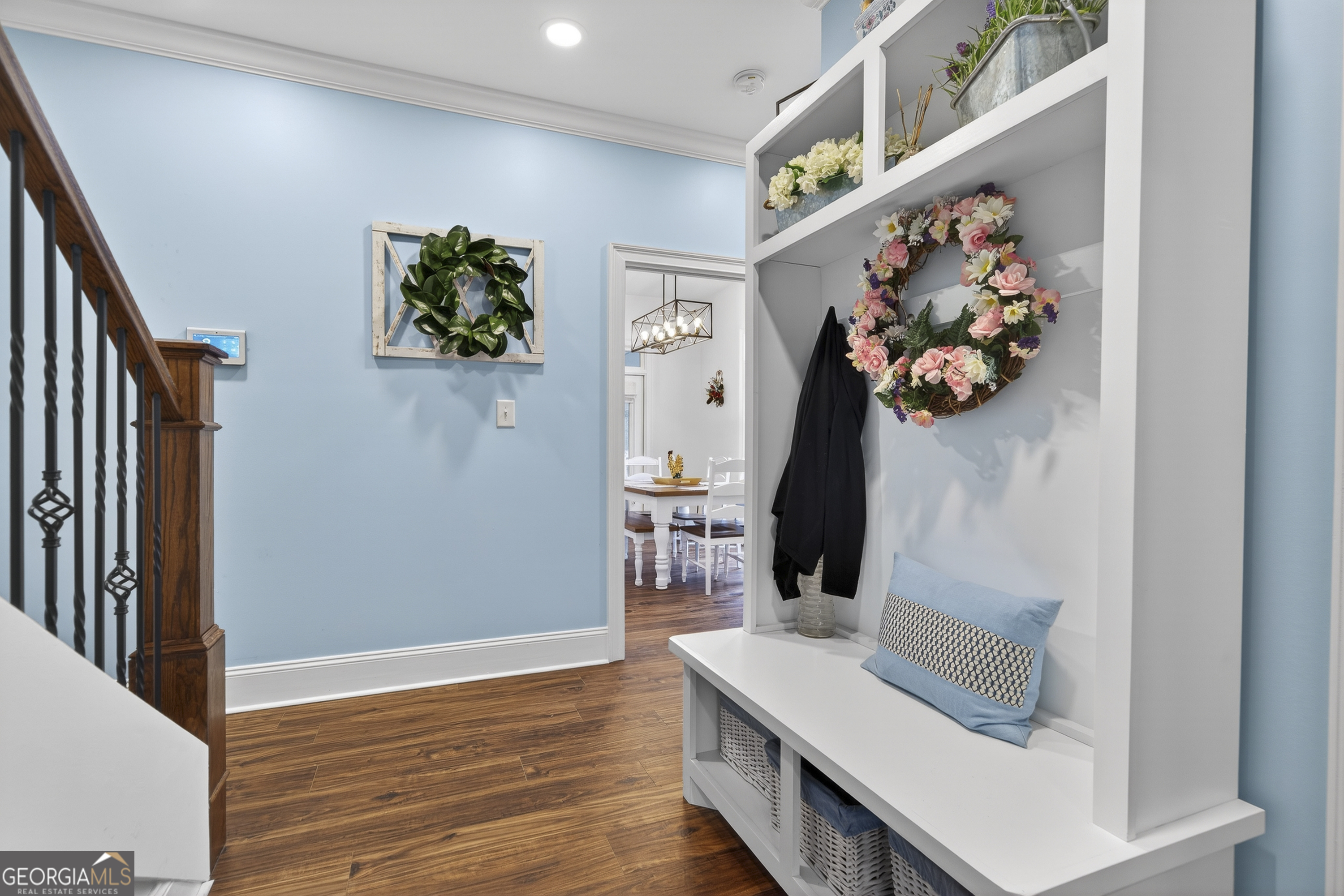 137 Butler Road Southeast Milledgeville, GA 31061 - Photo 38 of 82 a room with painting on the wall and a wooden floor