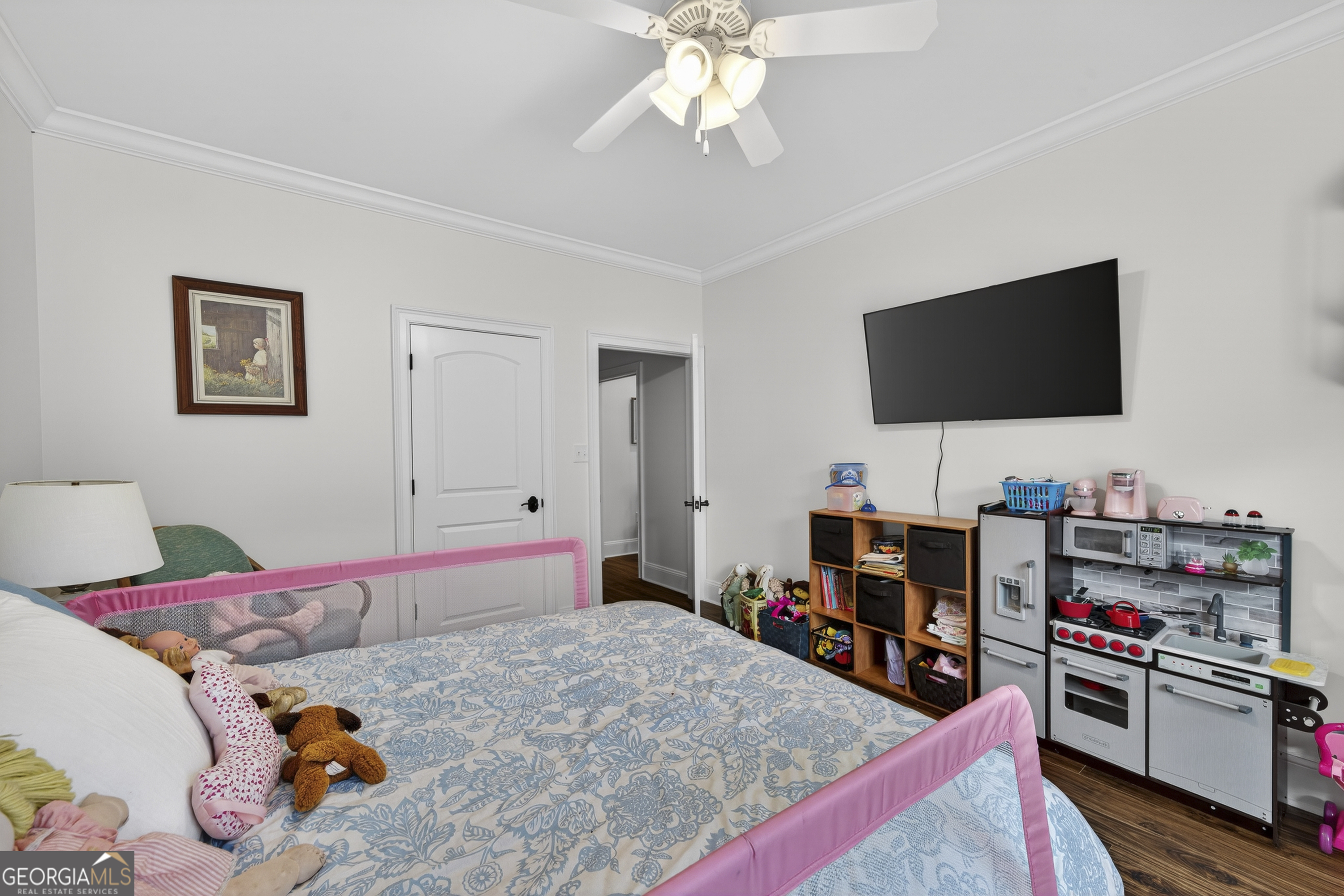 137 Butler Road Southeast Milledgeville, GA 31061 - Photo 42 of 82 a bedroom with a bed and a flat screen tv