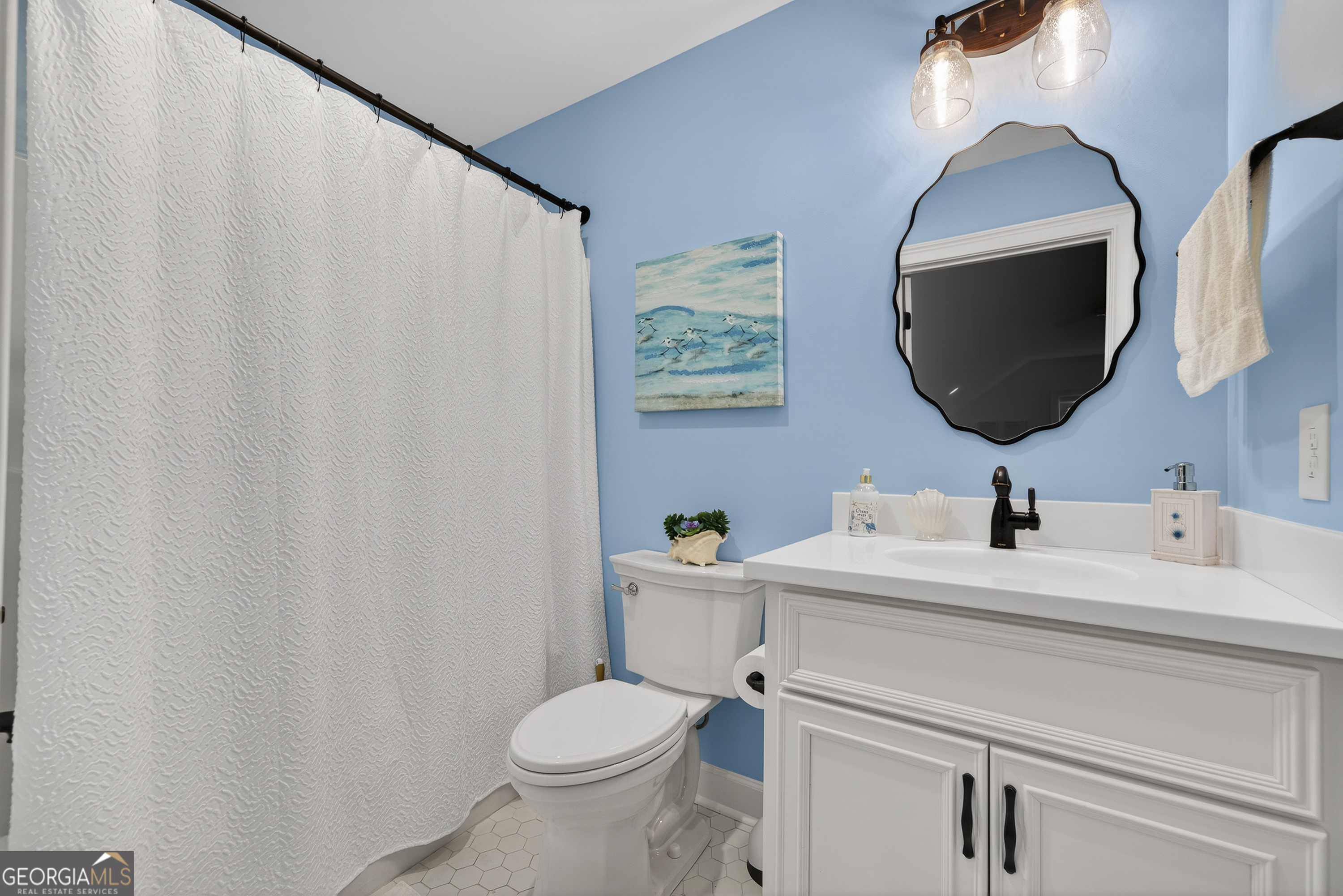 137 Butler Road Southeast Milledgeville, GA 31061 - Photo 55 of 82 a bathroom with a sink mirror and toilet