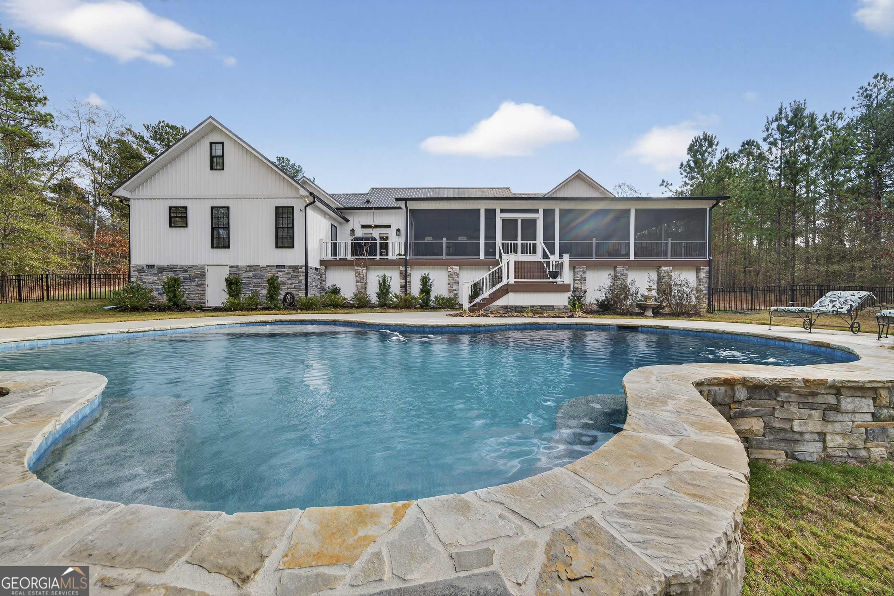 137 Butler Road Southeast Milledgeville, GA 31061 - Photo 64 of 82 a swimming pool with outdoor seating and yard