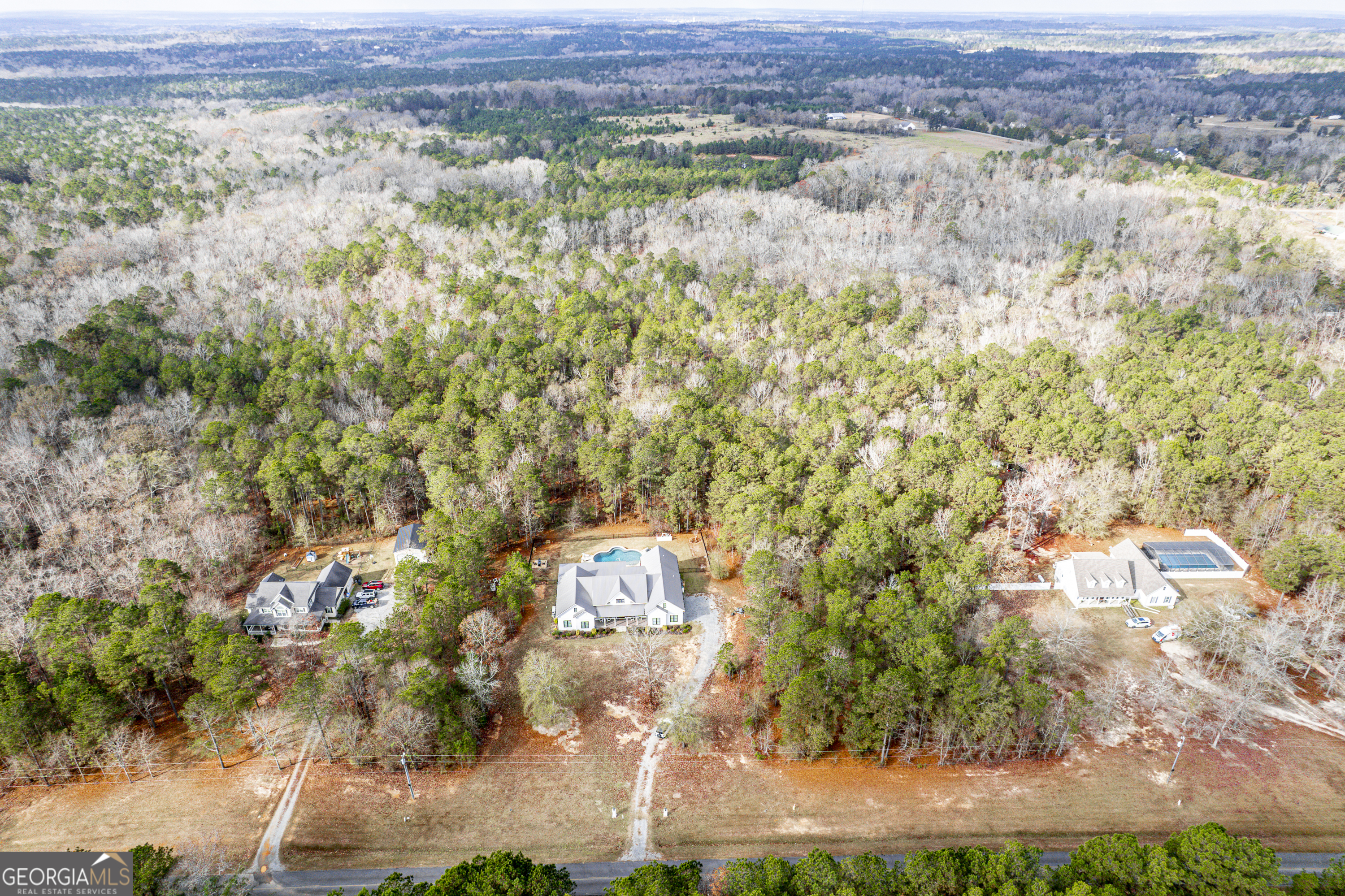 137 Butler Road Southeast Milledgeville, GA 31061 - Photo 77 of 82 an aerial view of residential houses with outdoor space and trees