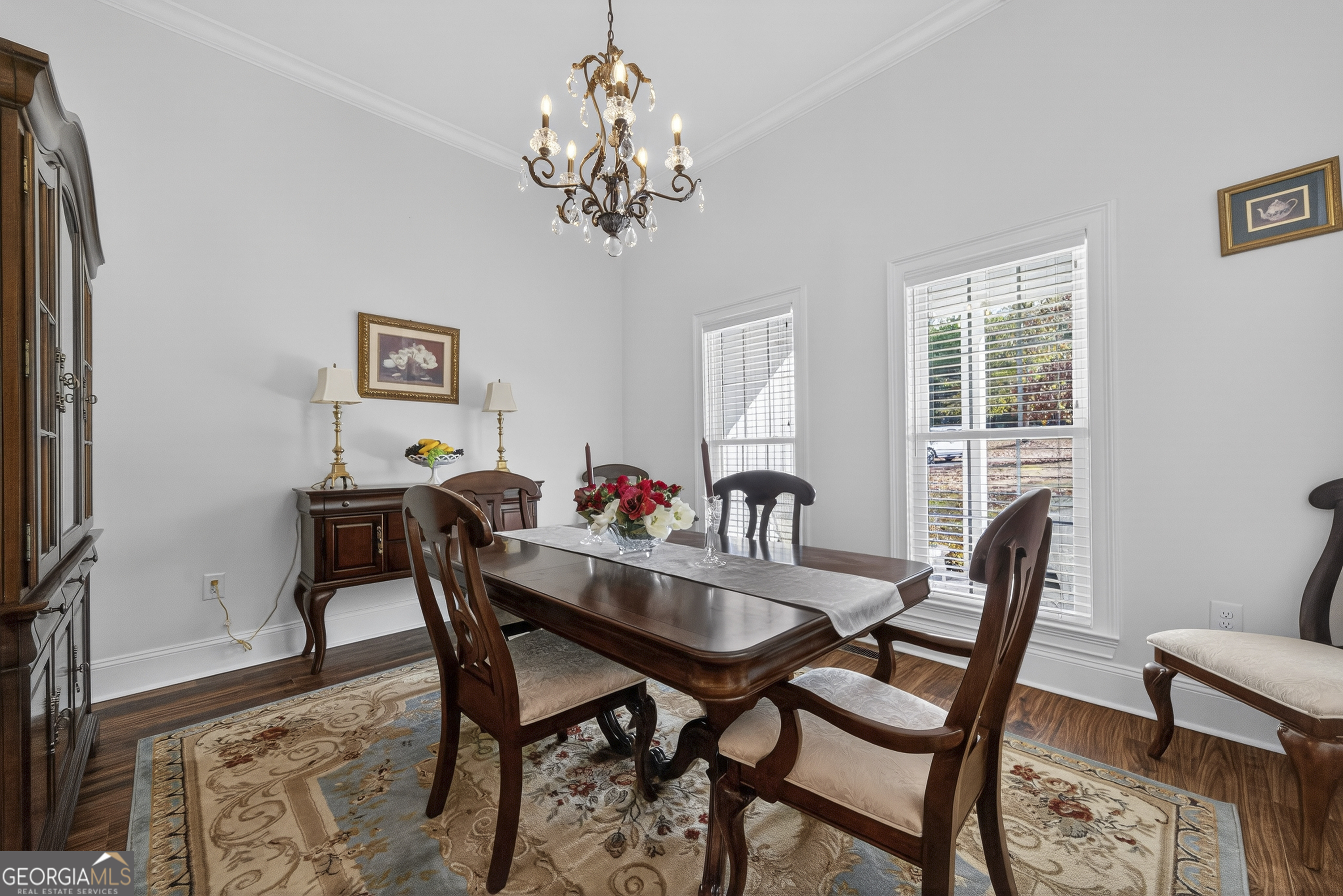 137 Butler Road Southeast Milledgeville, GA 31061 - Photo 8 of 82 a dining room with furniture a chandelier and window