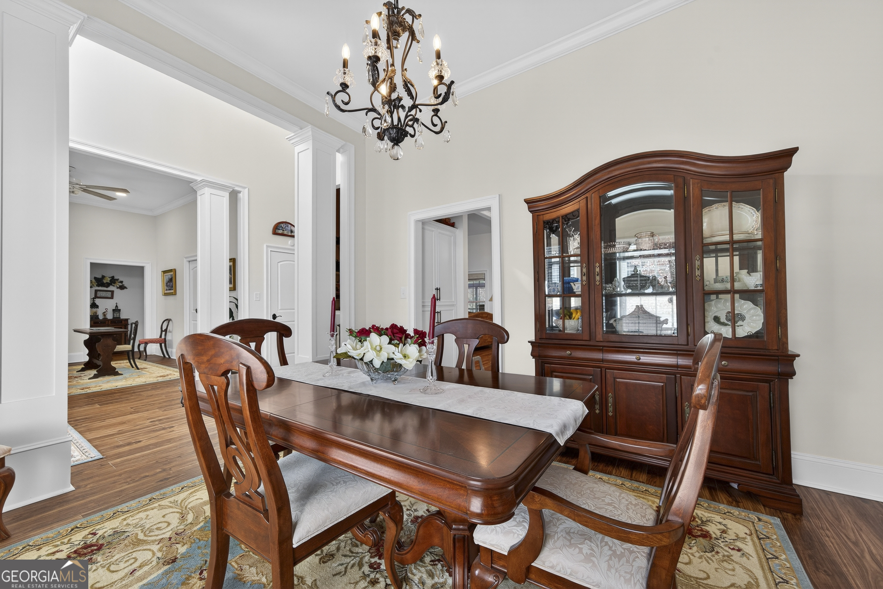 137 Butler Road Southeast Milledgeville, GA 31061 - Photo 9 of 82 a dining room with furniture a chandelier and wooden floor