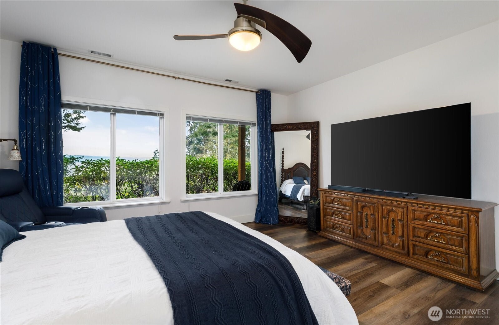 209 East Sara Vista Road Coupeville, WA 98239 - Photo 24 of 40 a bedroom with a bed and a flat tv screen on dresser